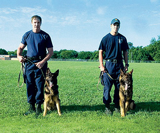 Like father, like son: Dave Roesler and his son, Stephen, are both K-9 officers with the Baltimore Police Department, which has the state’s second-oldest K-9 unit.